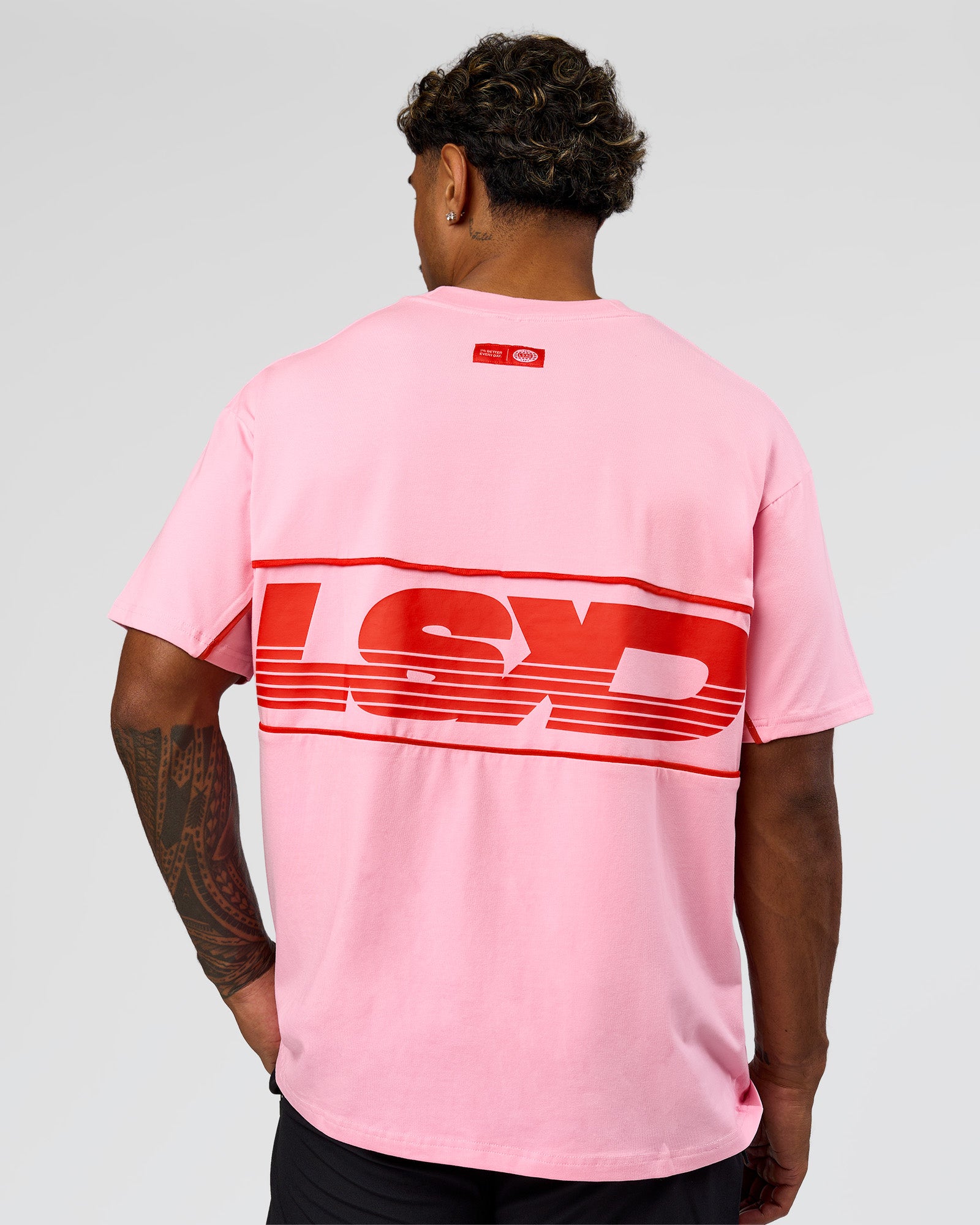 Man wearing Inline Heavyweight FLXCotton Oversized Tee - Pink Rose-Flame | Model:Xav | Size:L