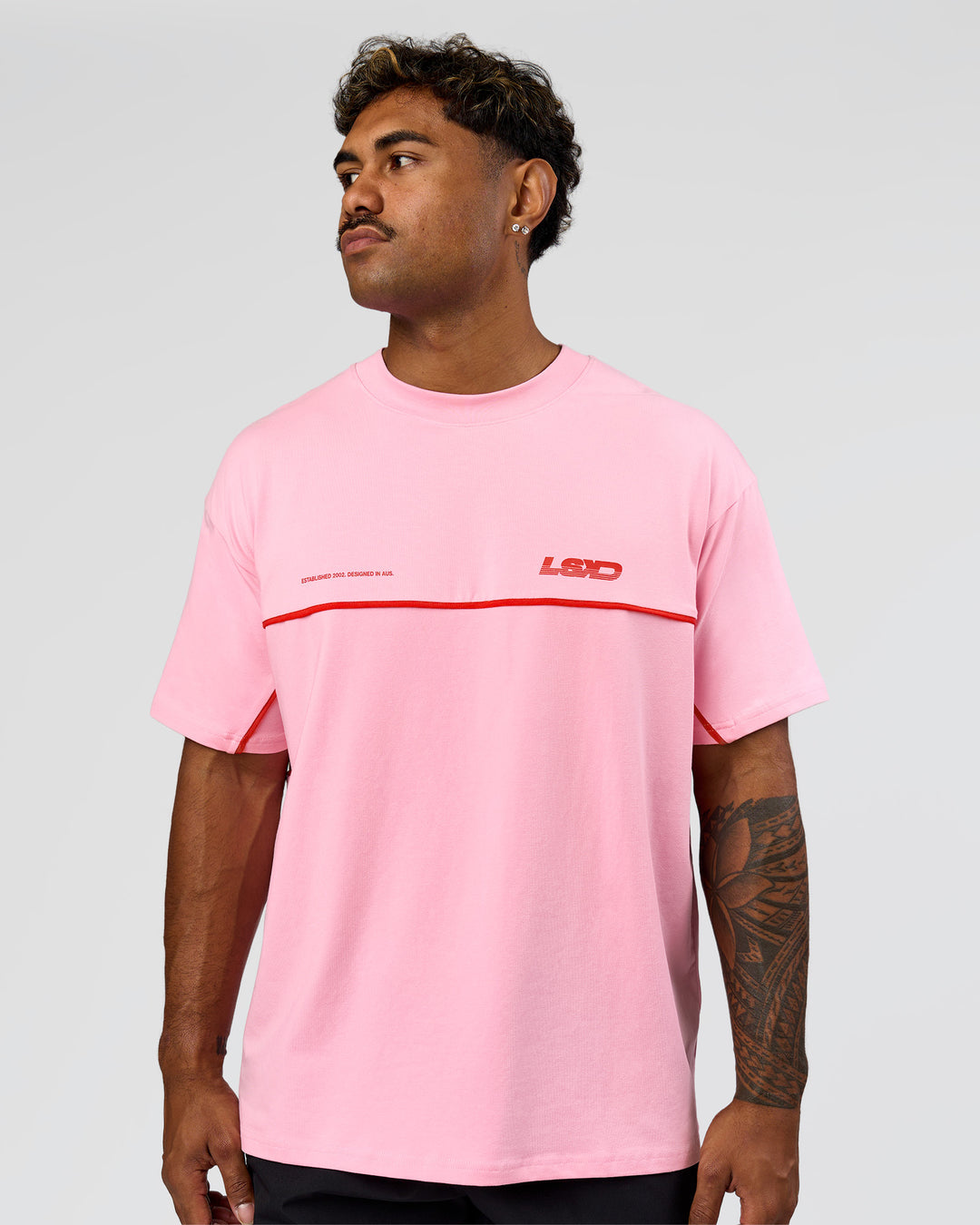 Man wearing Inline Heavyweight FLXCotton Oversized Tee - Pink Rose-Flame | Model:Xav | Size:L - view 5