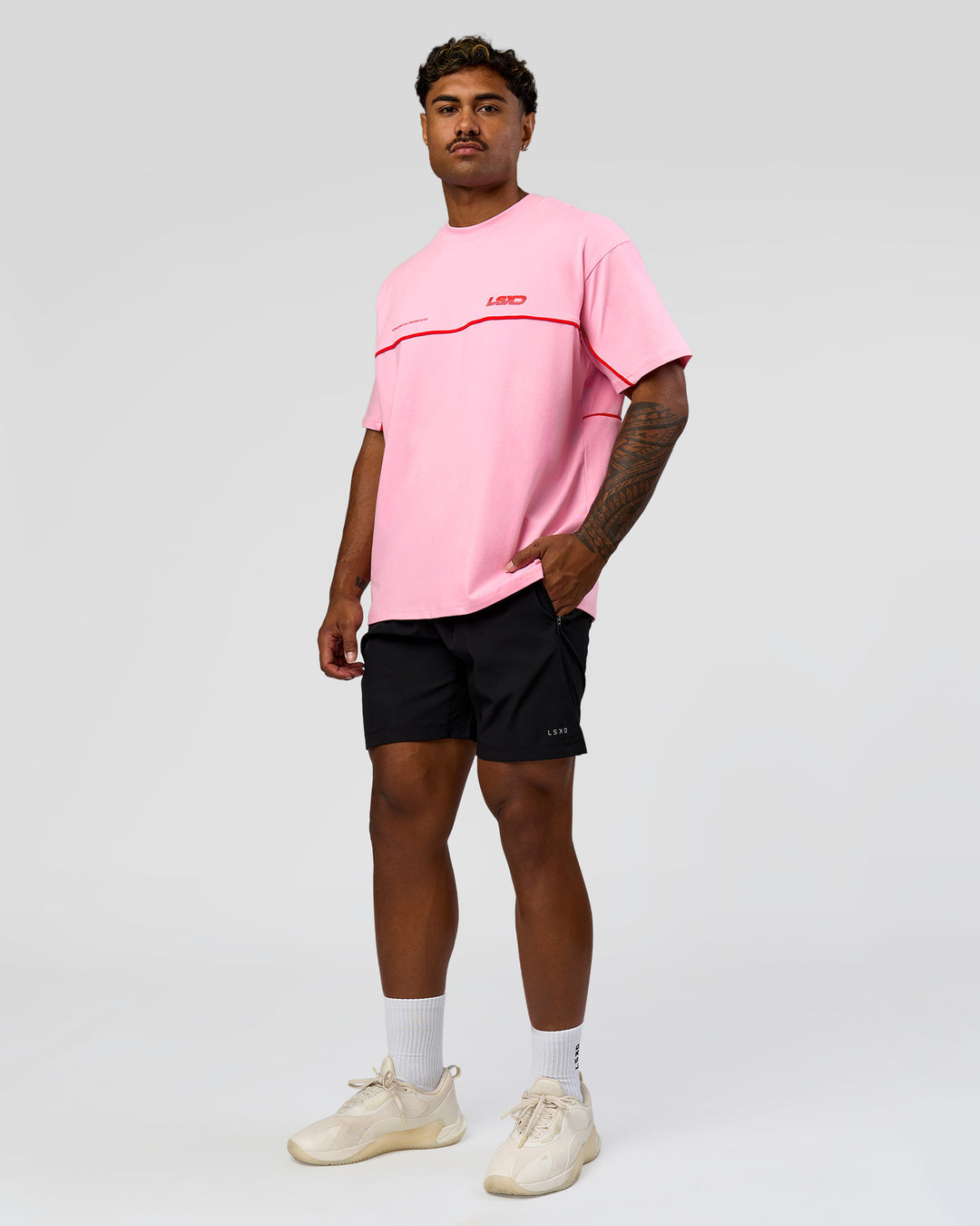 Man wearing Inline Heavyweight FLXCotton Oversized Tee - Pink Rose-Flame | Model:Xav | Size:L - view 17