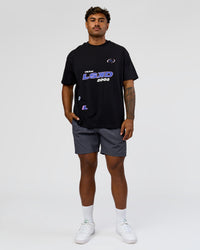 Man wearing League Heavyweight FLXCotton Oversized Tee - Black-Power Cobalt | Model:Xav | Size:L