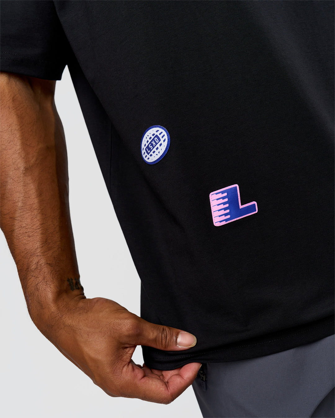 Man wearing League Heavyweight FLXCotton Oversized Tee - Black-Power Cobalt | Model:Xav | Size:L
