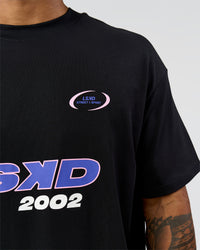 Man wearing League Heavyweight FLXCotton Oversized Tee - Black-Power Cobalt | Model:Xav | Size:L