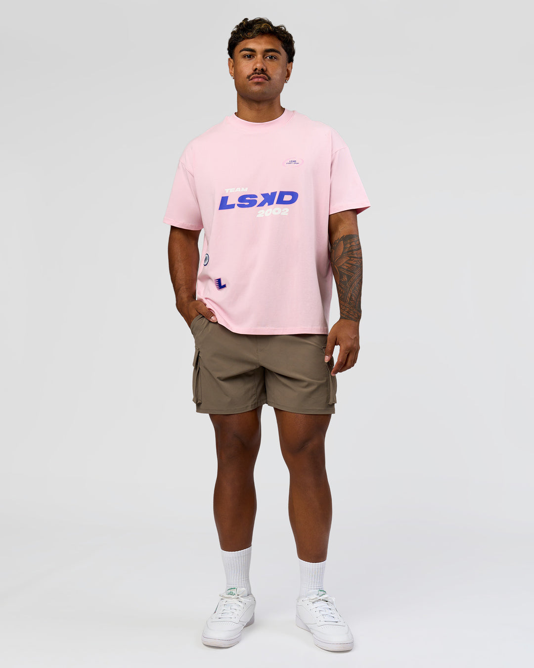 Man wearing League Heavyweight FLXCotton Oversized Tee - Marshmallow-Power Cobalt | Model:Xav | Size:L