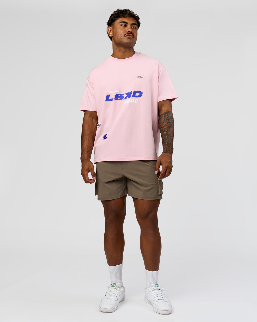 Man wearing League Heavyweight FLXCotton Oversized Tee - Marshmallow-Power Cobalt | Model:Xav | Size:L