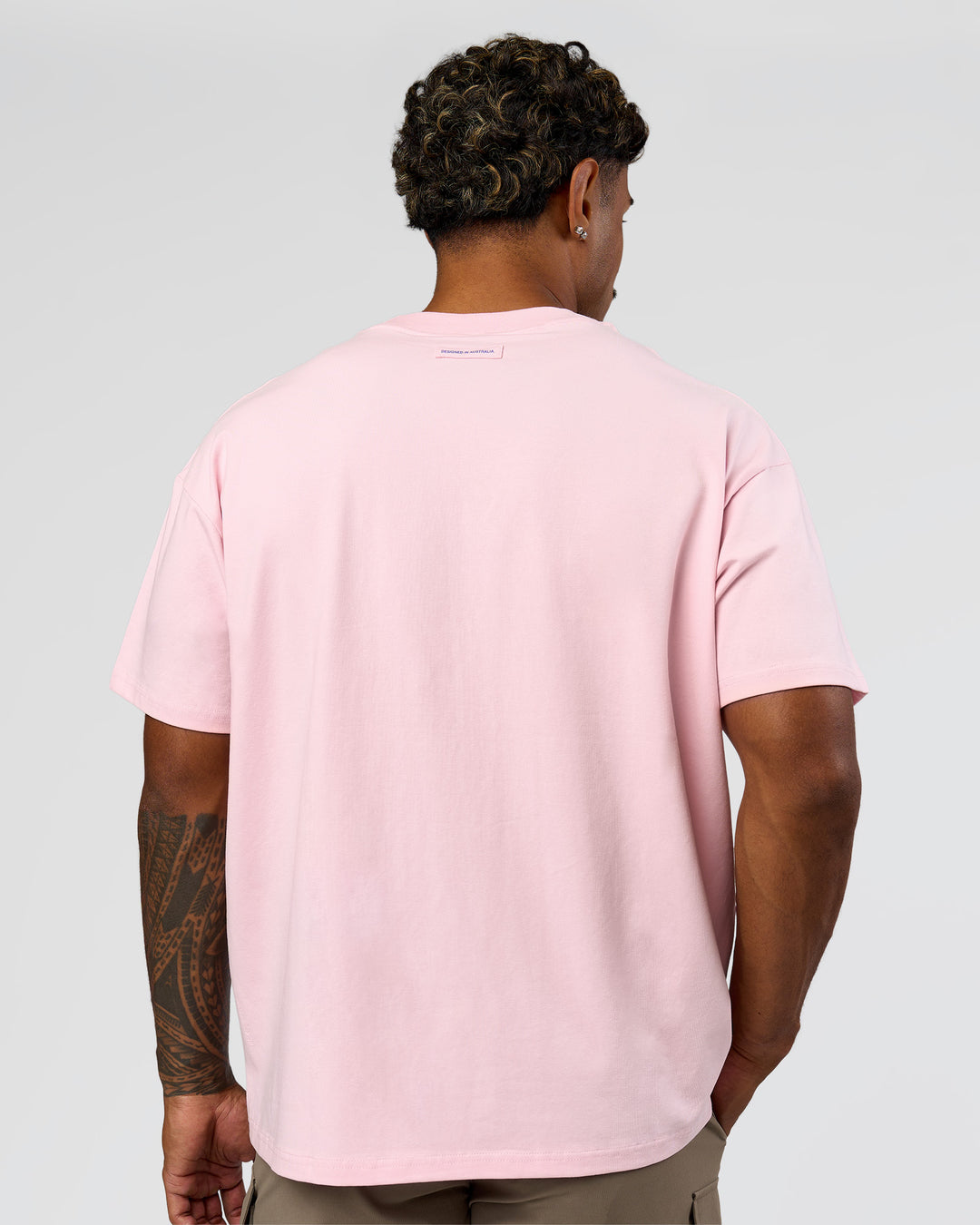 Man wearing League Heavyweight FLXCotton Oversized Tee - Marshmallow-Power Cobalt | Model:Xav | Size:L