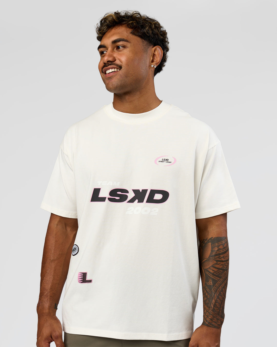 Man wearing League Heavyweight FLXCotton Oversized Tee - Off White-Ground Coffee | Model:Xav | Size:L