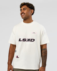 Man wearing League Heavyweight FLXCotton Oversized Tee - Off White-Ground Coffee | Model:Xav | Size:L