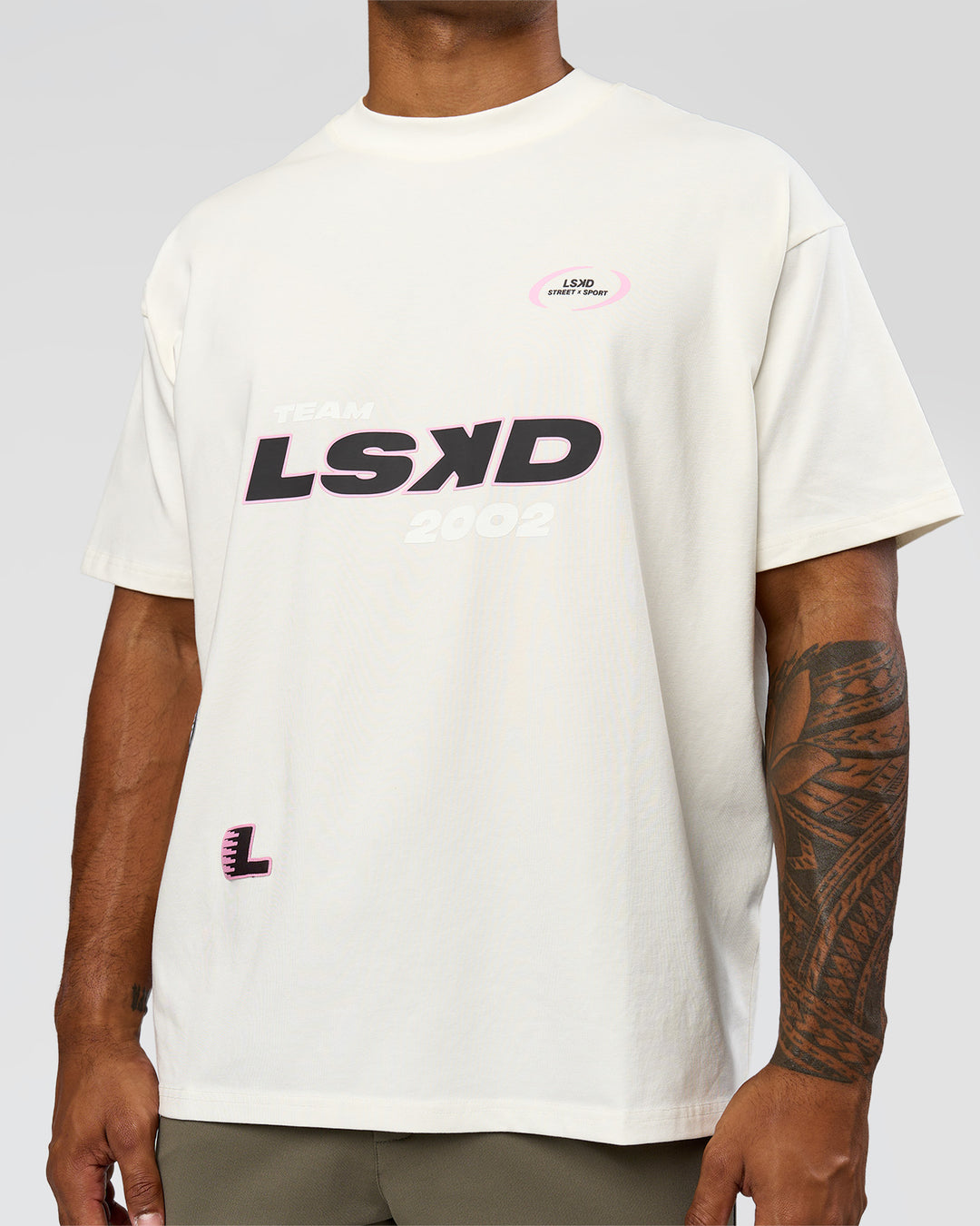 Man wearing League Heavyweight FLXCotton Oversized Tee - Off White-Ground Coffee | Model:Xav | Size:L