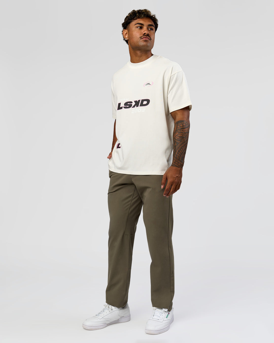 Man wearing League Heavyweight FLXCotton Oversized Tee - Off White-Ground Coffee | Model:Xav | Size:L