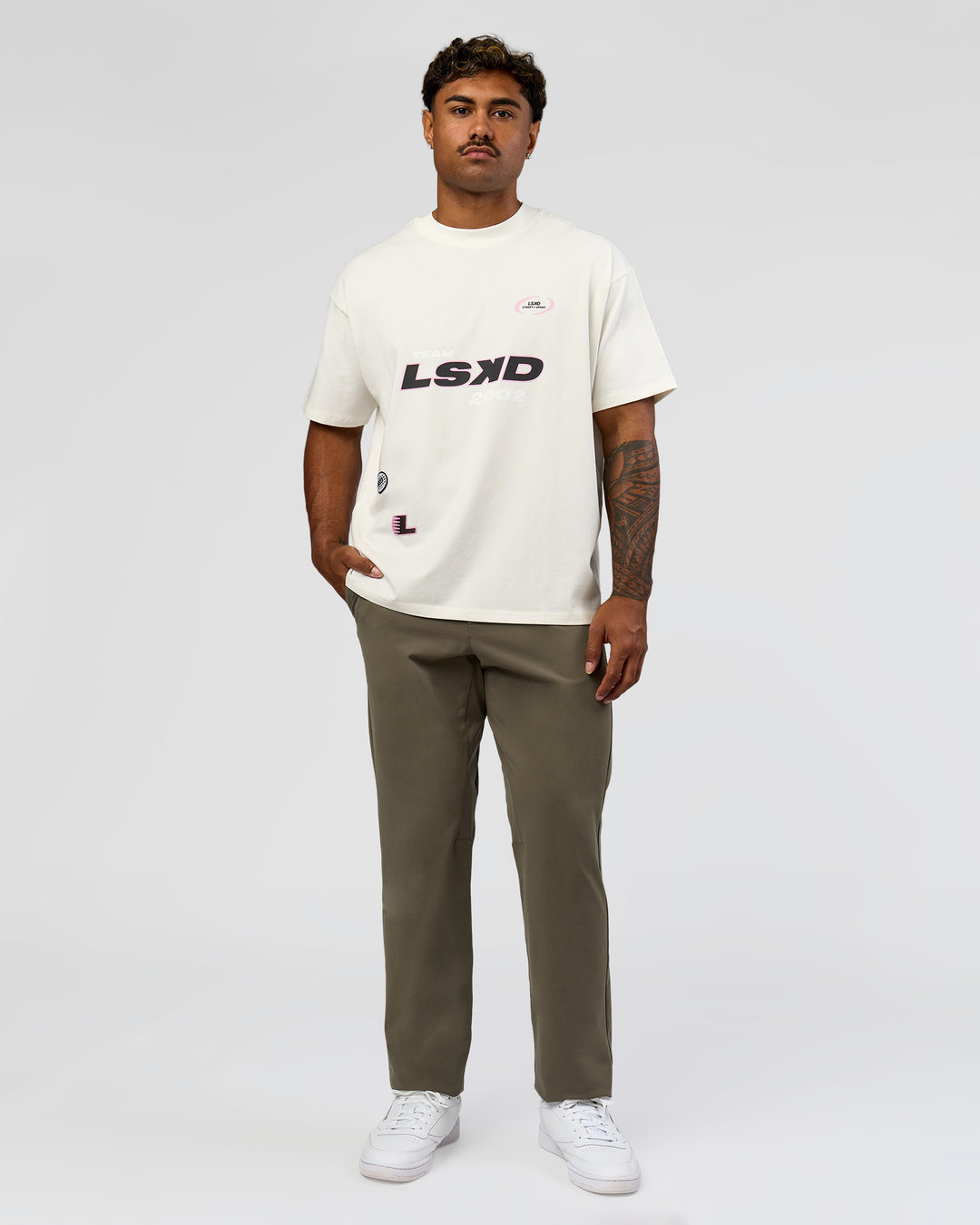 Man wearing League Heavyweight FLXCotton Oversized Tee - Off White-Ground Coffee | Model:Xav | Size:L