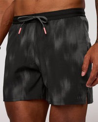 Man wearing Pace 5" Lined Running Short - Bitmap Blur Black | Model:Xav | Size:L | Thumbnail Index: 0