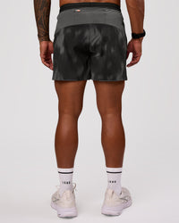 Man wearing Pace 5" Lined Running Short - Bitmap Blur Black | Model:Xav | Size:L | Thumbnail Index: 2