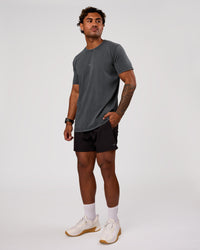 Man wearing Rep 5" Performance Short - Black | Model:Xav | Size:L | Thumbnail Index: 4