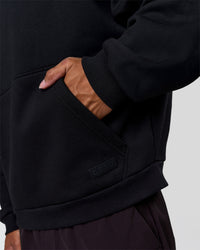 Man wearing Tonal Legacy Boxy Hoodie - Black-Black | Model:Xav | Size:L | Thumbnail Index: 15