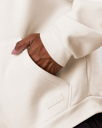 Man wearing Tonal Legacy Boxy Hoodie - Off White-Off White | Model:Xav | Size:L | Thumbnail Index: 16