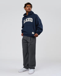 Man wearing Varsity Boxy Hoodie - Future Navy-White | Model:Xav | Size:L | Thumbnail Index: 5
