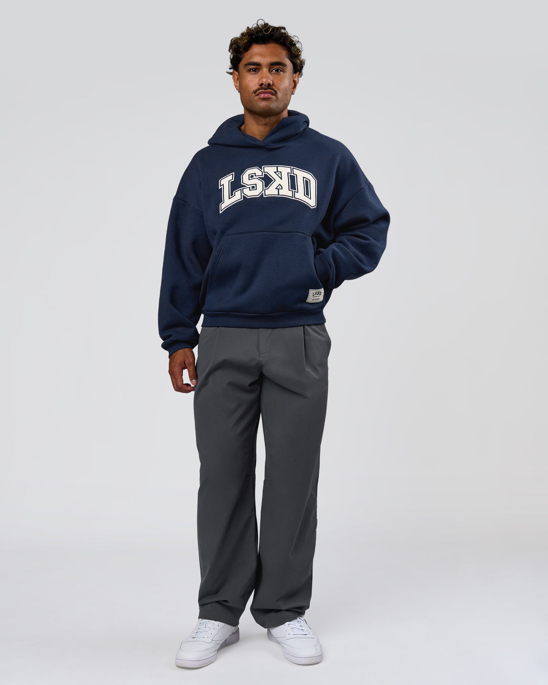 Man wearing Varsity Boxy Hoodie - Future Navy-White | Model:Xav | Size:L - view 10