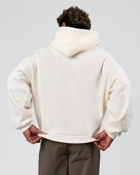 Man wearing Varsity Boxy Hoodie - Off White-Pink Rose | Model:Xav | Size:L | Thumbnail Index: 4