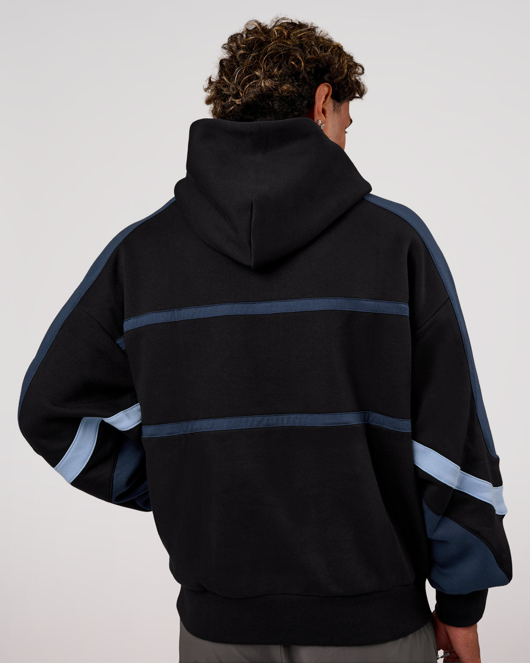 Man wearing Vibe Oversized Hoodie - Black-Future Navy | Model:Xav | Size:L - view 5