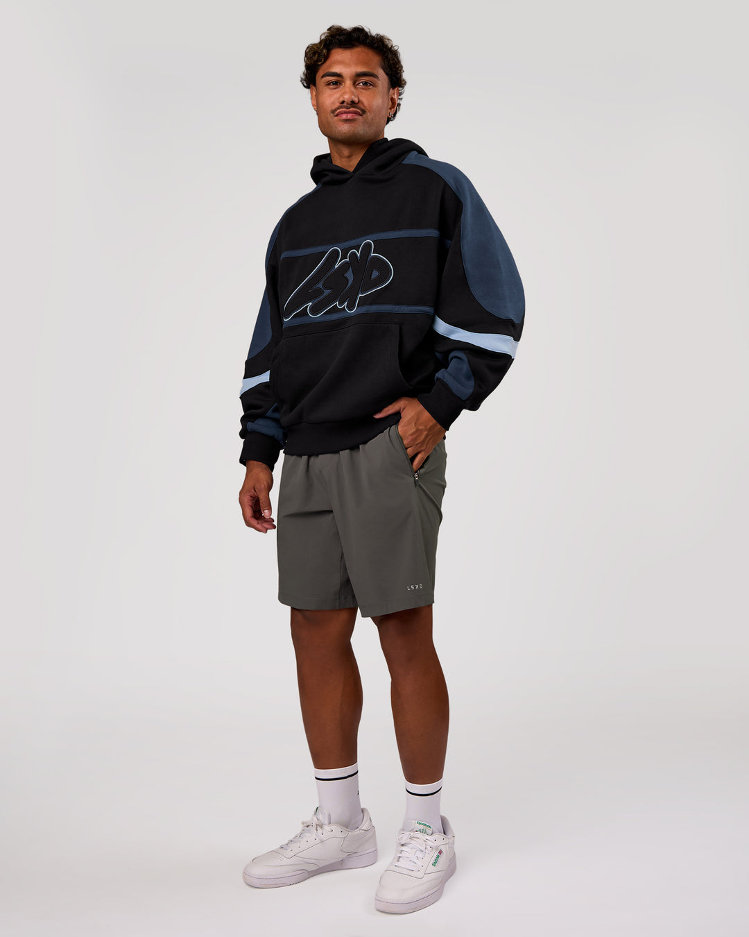 Man wearing Vibe Oversized Hoodie - Black-Future Navy | Model:Xav | Size:L - view 9