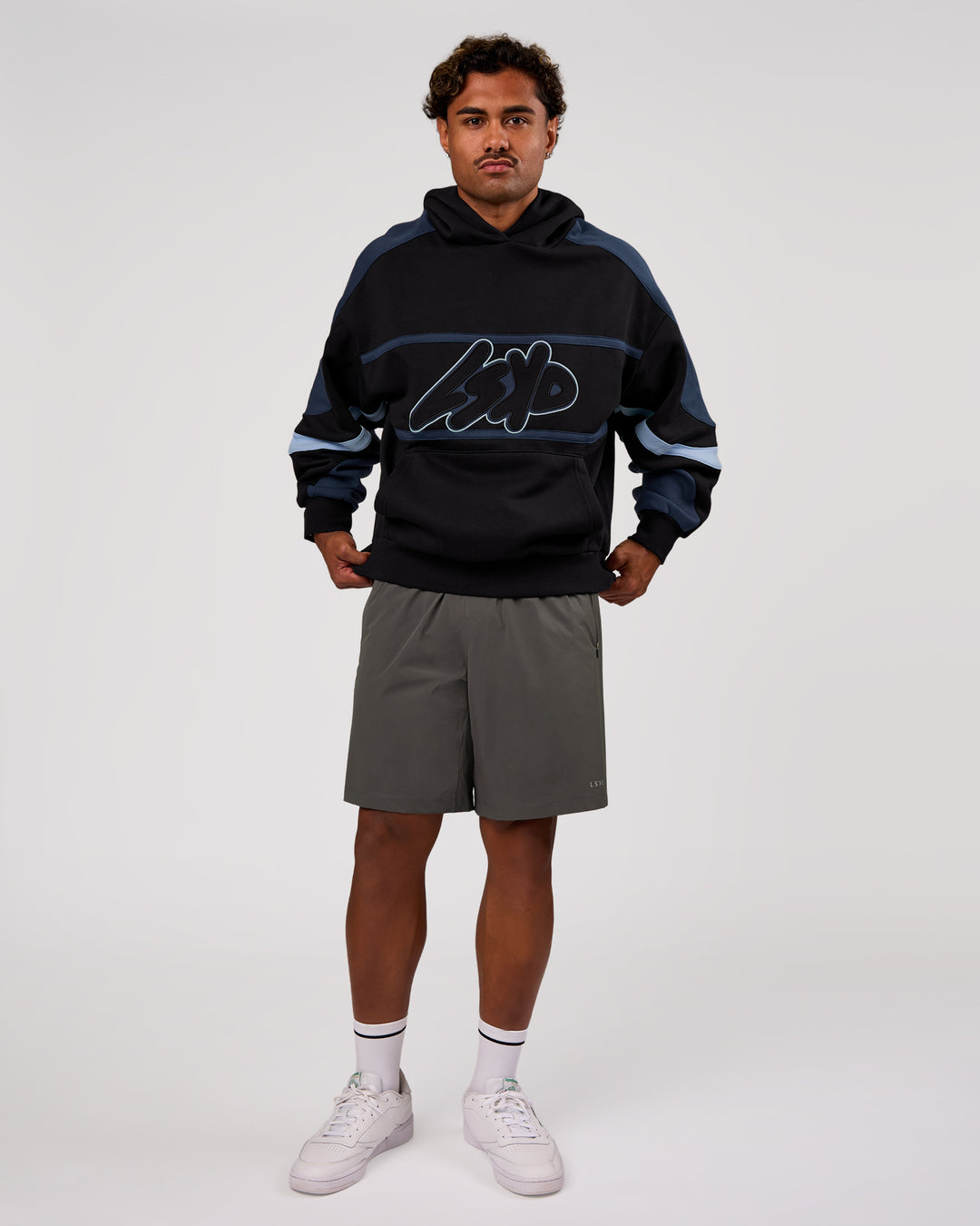 Man wearing Vibe Oversized Hoodie - Black-Future Navy | Model:Xav | Size:L - view 11