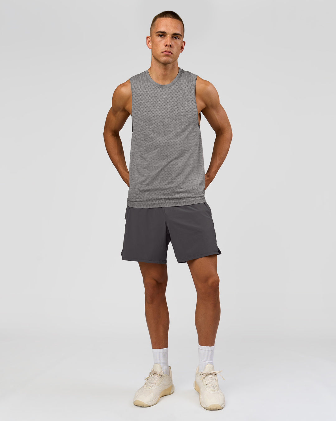 Man wearing AeroFLX+ Seamless Muscle Tank - Dark Storm/Alloy | Model:Albert | Size:M - view 2