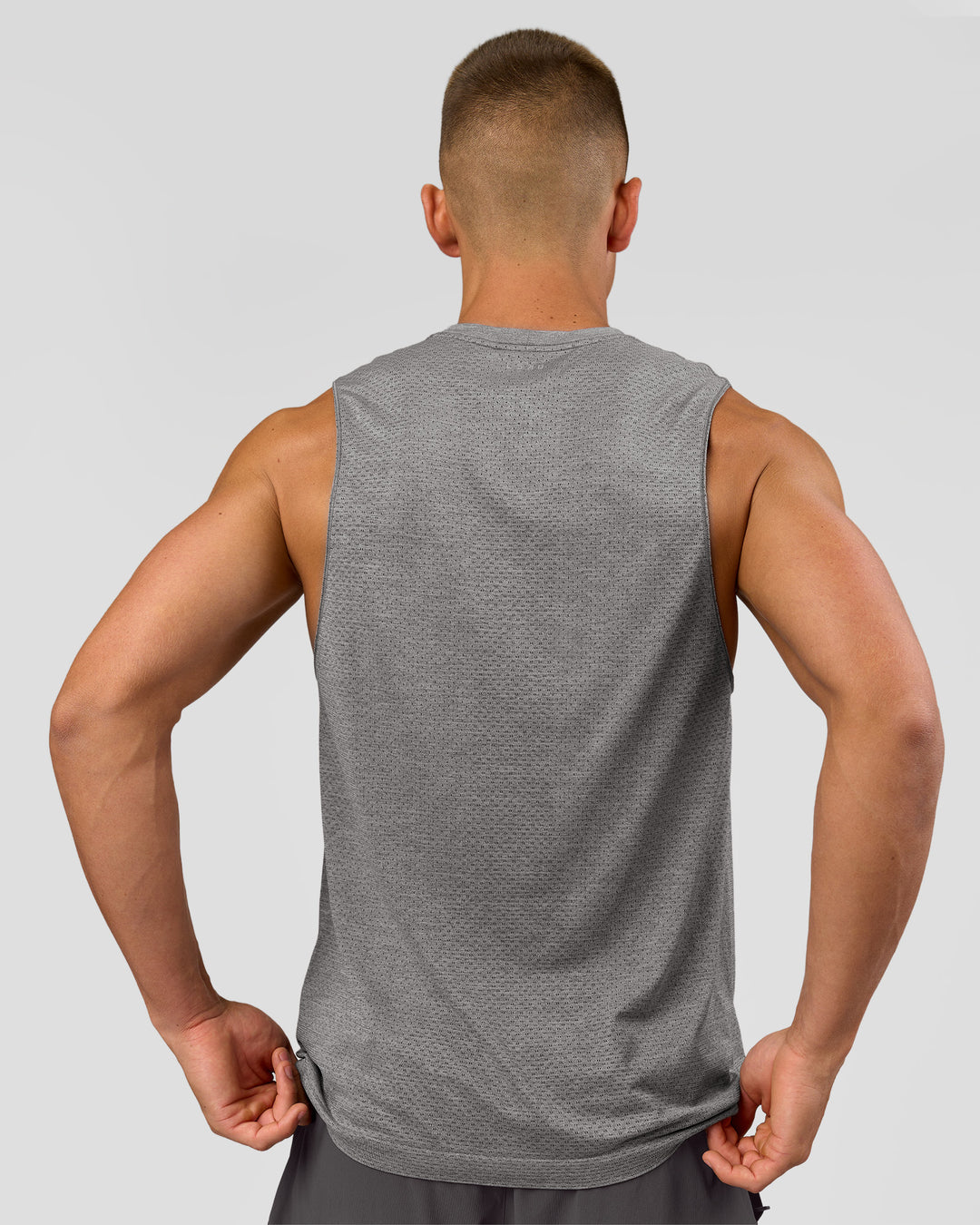 Man wearing AeroFLX+ Seamless Muscle Tank - Dark Storm/Alloy | Model:Albert | Size:M - view 4