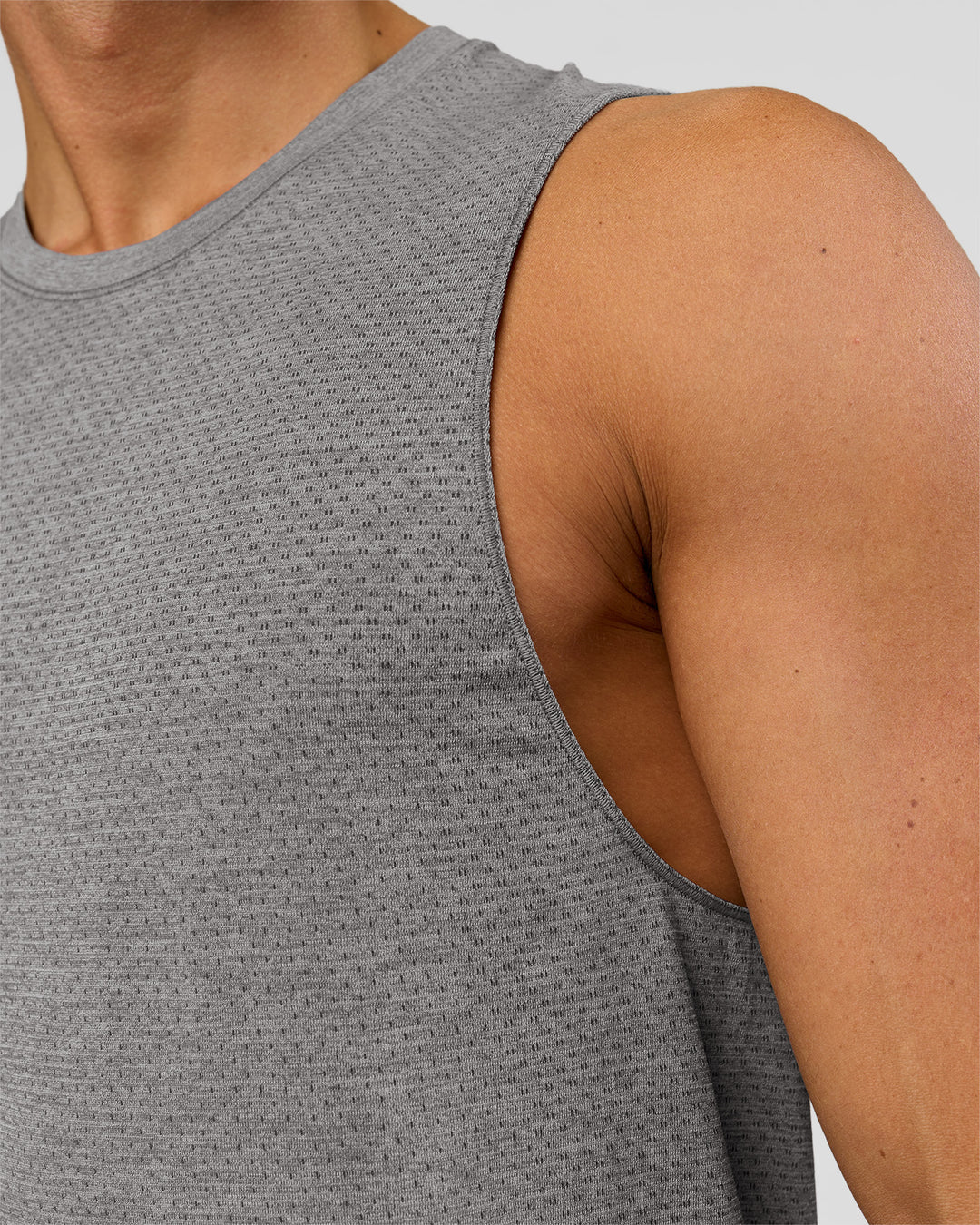 Man wearing AeroFLX+ Seamless Muscle Tank - Dark Storm/Alloy | Model:Albert | Size:M - view 6