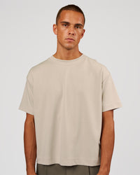 Man wearing AfterDark ZeroCrease Boxy Tee - Shale Beige | Model:Albert | Size:M | Thumbnail Index: 0