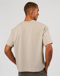 Man wearing AfterDark ZeroCrease Boxy Tee - Shale Beige | Model:Albert | Size:M | Thumbnail Index: 1