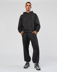 Man wearing Base Oversized DC Hoodie - Onyx | Model:Albert | Size:M | Thumbnail Index: 9