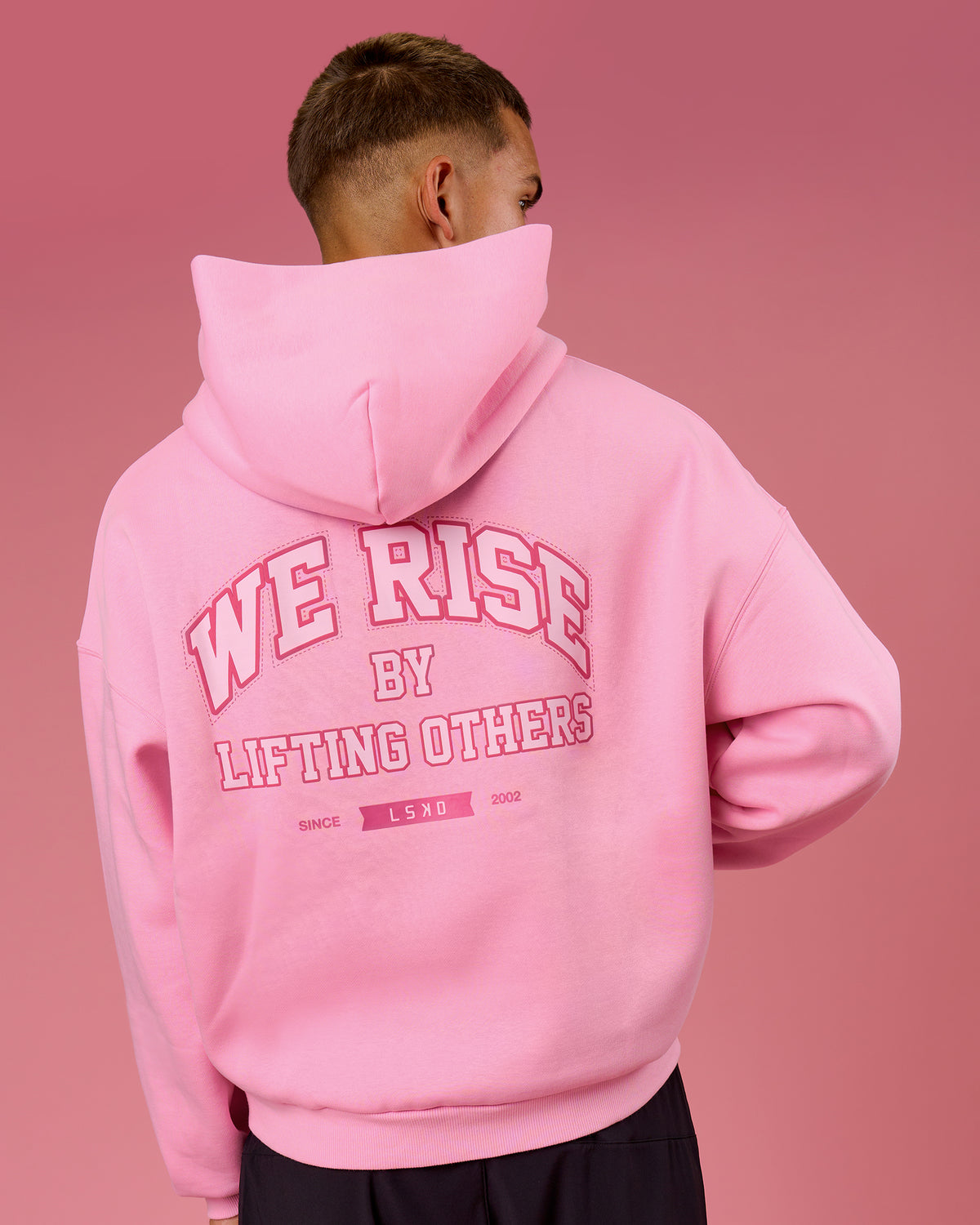 Man wearing BCAM Heavyweight Boxy Hoodie - Pink Rose | Model:Albert | Size:M