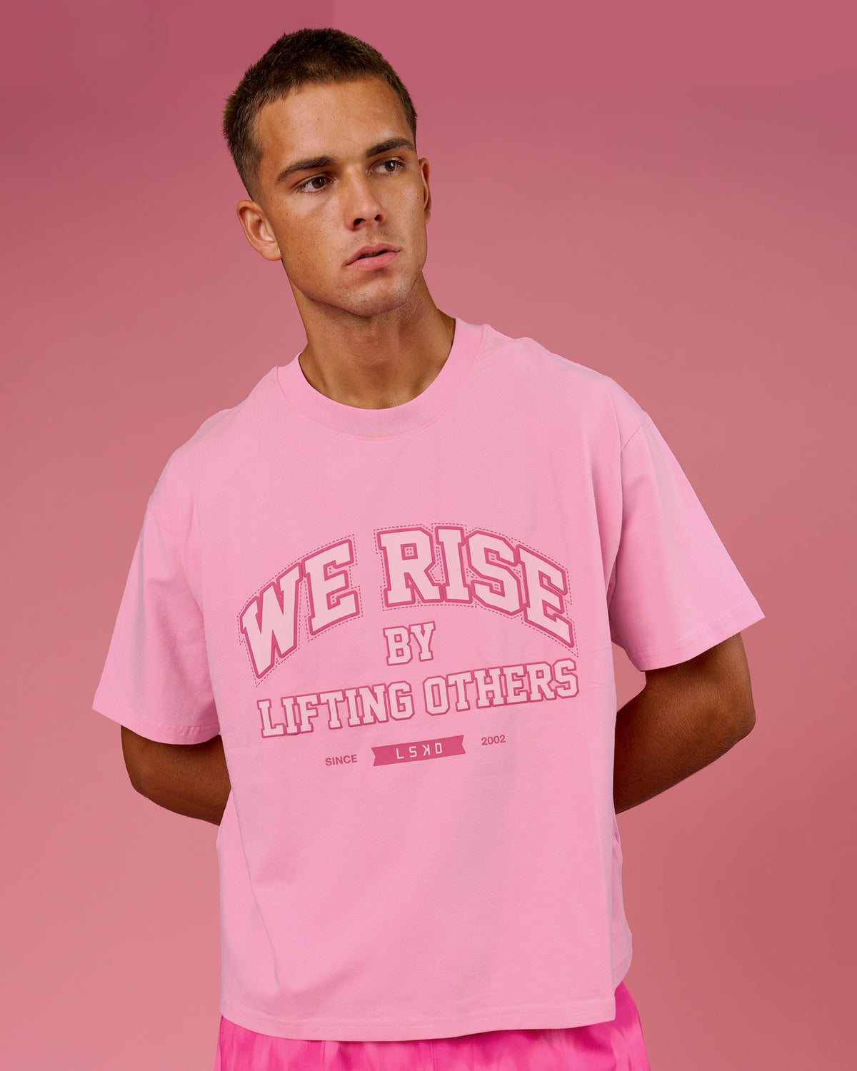 Man wearing BCAM Heavyweight FLXCotton Graphic Boxed Tee - Pink Rose | Model:Albert | Size:M