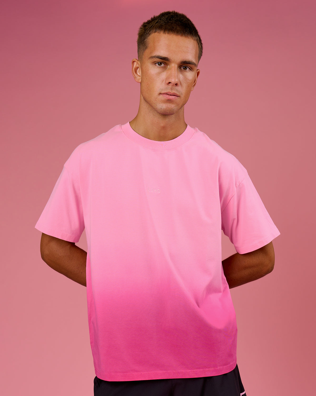 Man wearing BCAM Ombre Heavyweight FLXCotton Oversized Tee  - Pink Rose-Ultra Pink | Model:Albert | Size:M