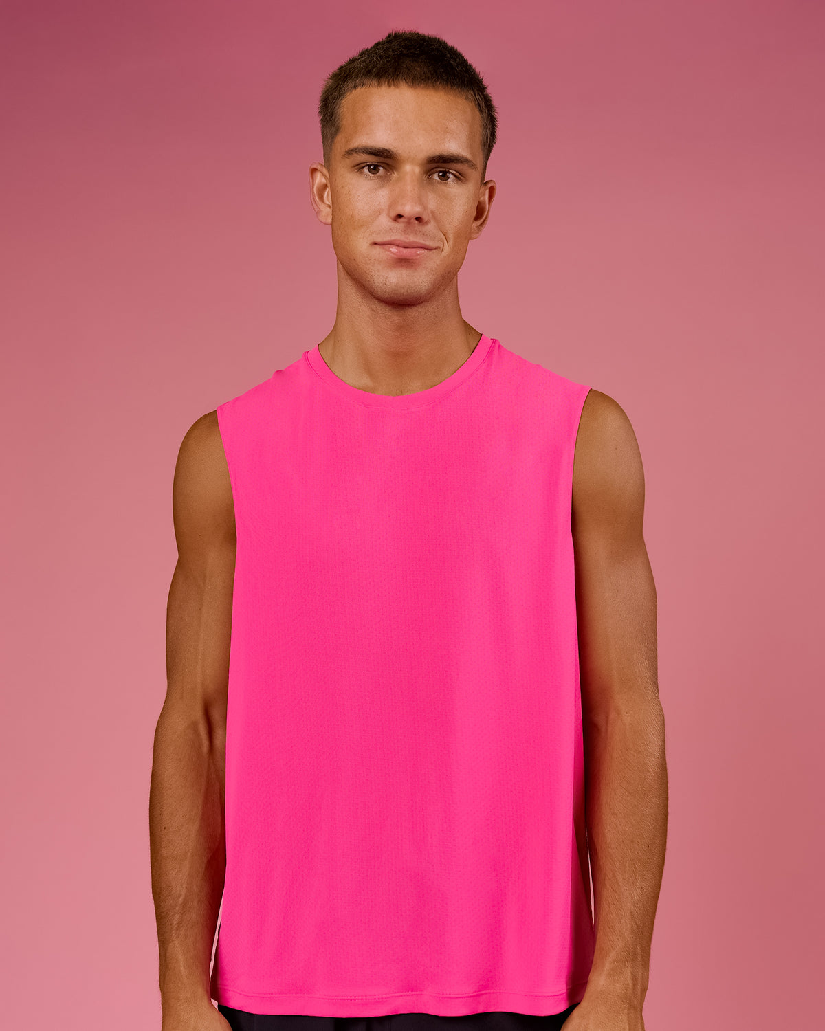 Man wearing BCAM Rep Muscle Training Tank - Ultra Pink | Model:Albert | Size:M