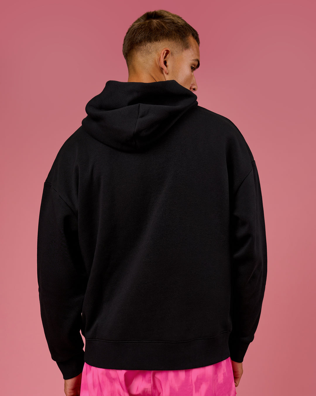 Man wearing BCAM Unisex Oversized Hoodie - Black | Model:Albert | Size:M - view 8