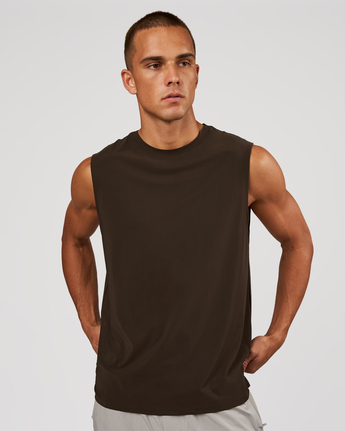 Man wearing Cadence MicroMotion Muscle Tank - Ground Coffee | Model:Albert | Size:M
