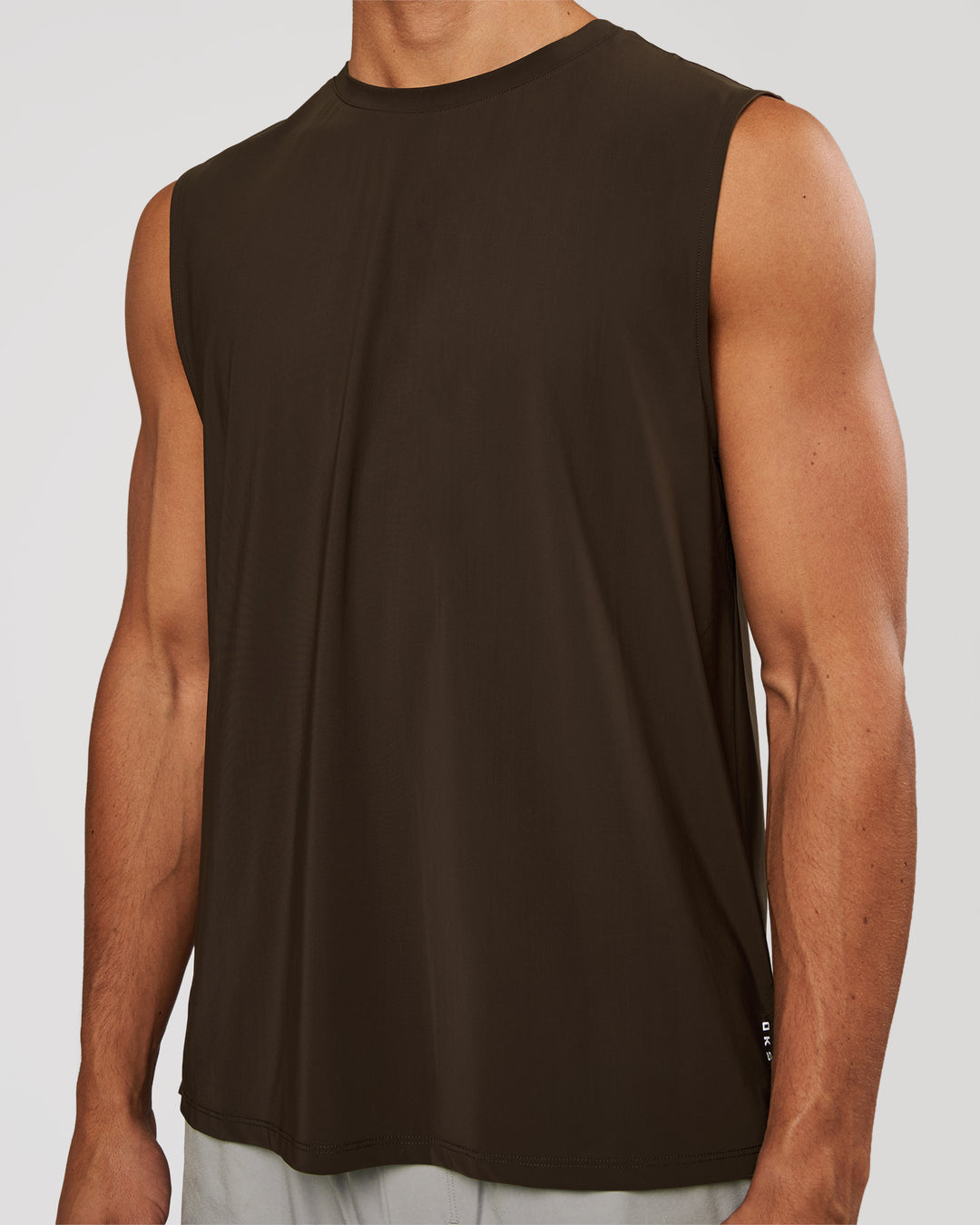 Man wearing Cadence MicroMotion Muscle Tank - Ground Coffee | Model:Albert | Size:M - view 1