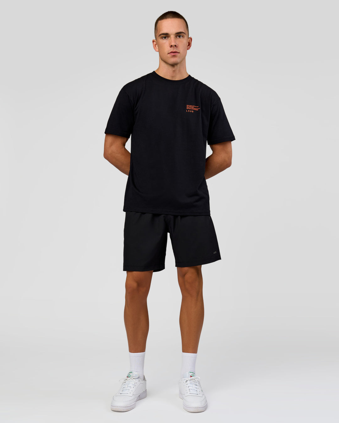 Man wearing Coffee Run FLXCotton Oversized Tee - Black-Ultra Orange | Model:Albert | Size:M - view 3
