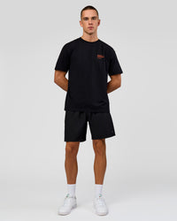 Man wearing Coffee Run FLXCotton Oversized Tee - Black-Ultra Orange | Model:Albert | Size:M | Thumbnail Index: 2
