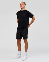 Man wearing Coffee Run FLXCotton Oversized Tee - Black-Ultra Orange | Model:Albert | Size:M | Thumbnail Index: 14