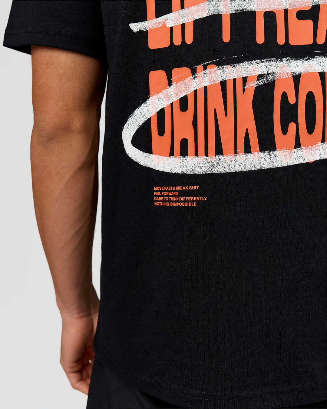 Man wearing Coffee Run FLXCotton Oversized Tee - Black-Ultra Orange | Model:Albert | Size:M - view 17
