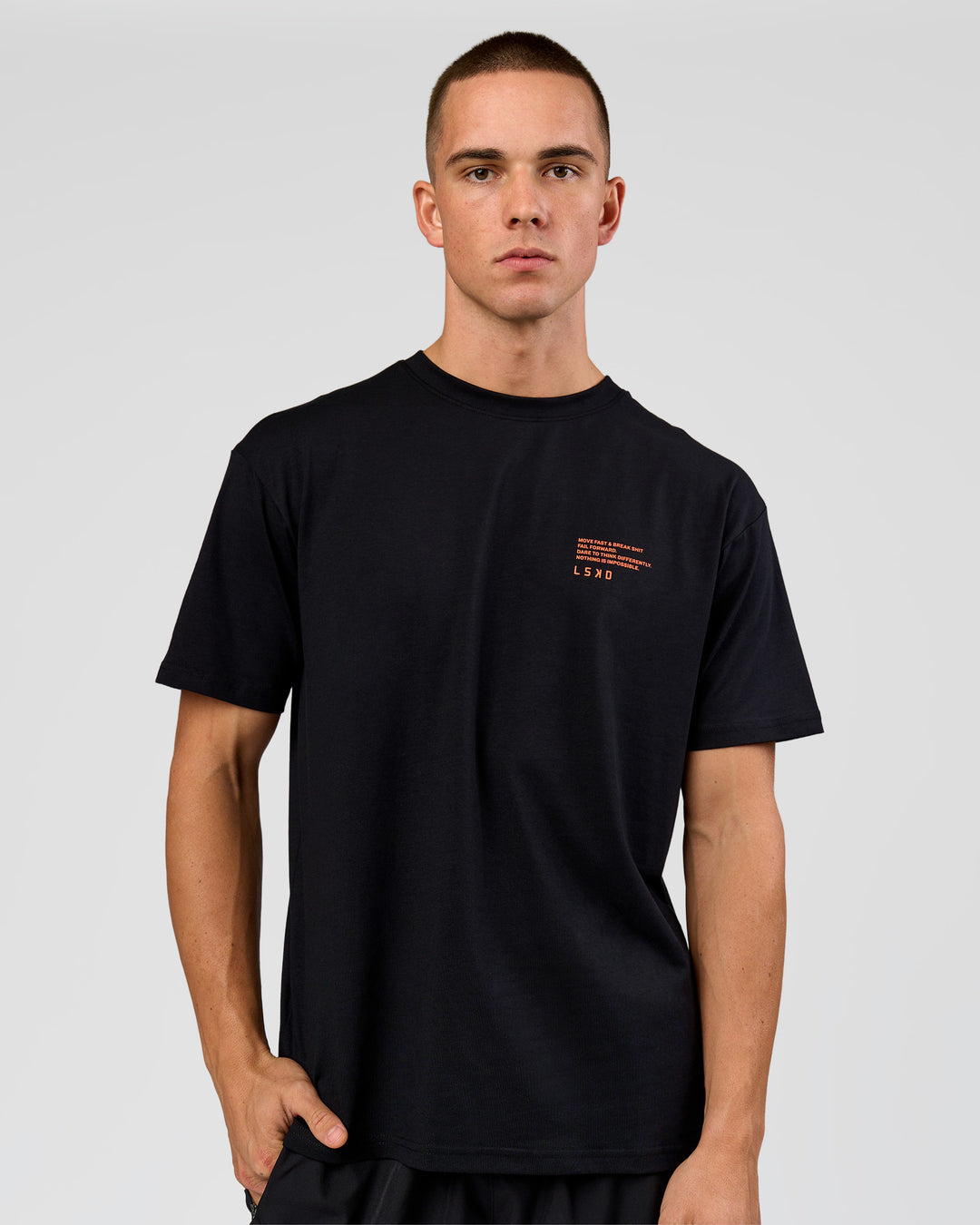 Man wearing Coffee Run FLXCotton Oversized Tee - Black-Ultra Orange | Model:Albert | Size:M - view 19