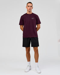 Man wearing Coffee Run FLXCotton Oversized Tee - Cherry Lacquer-Black | Model:Albert | Size:M | Thumbnail Index: 1