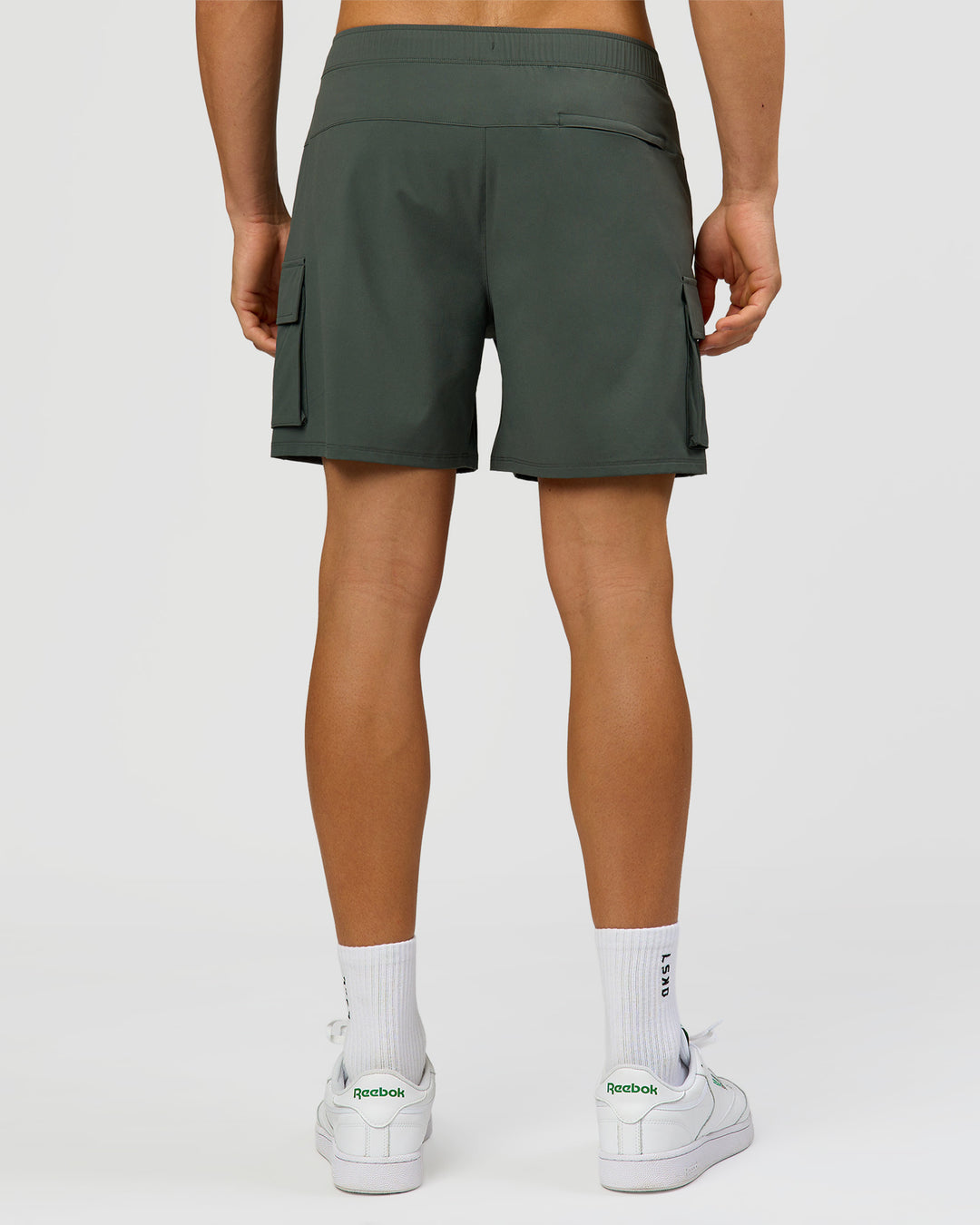 Man wearing Functional Cargo 6" Short - Carbon Green | Model:Albert | Size:M