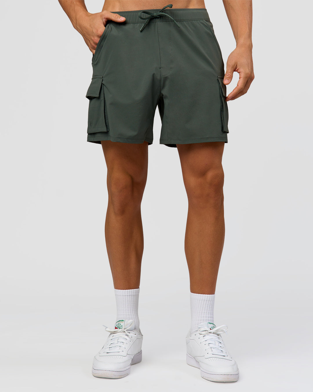 Man wearing Functional Cargo 6" Short - Carbon Green | Model:Albert | Size:M