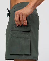 Man wearing Functional Cargo 6" Short - Carbon Green | Model:Albert | Size:M