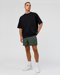 Man wearing Functional Cargo 6" Short - Carbon Green | Model:Albert | Size:M