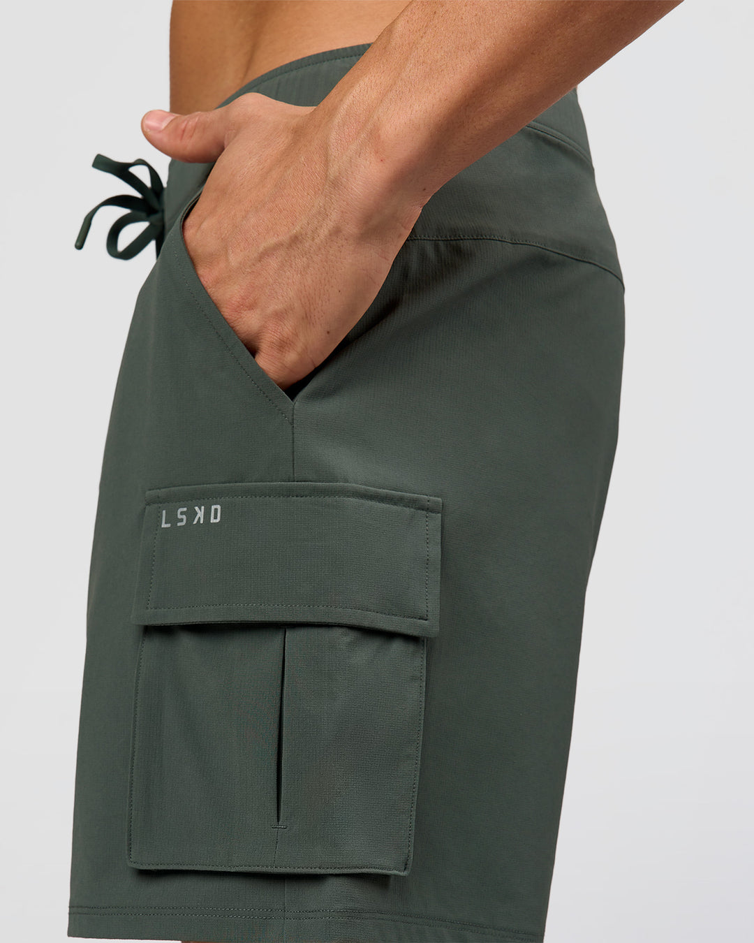 Man wearing Functional Cargo 6" Short - Carbon Green | Model:Albert | Size:M