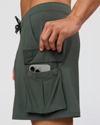 Man wearing Functional Cargo 6" Short - Carbon Green | Model:Albert | Size:M